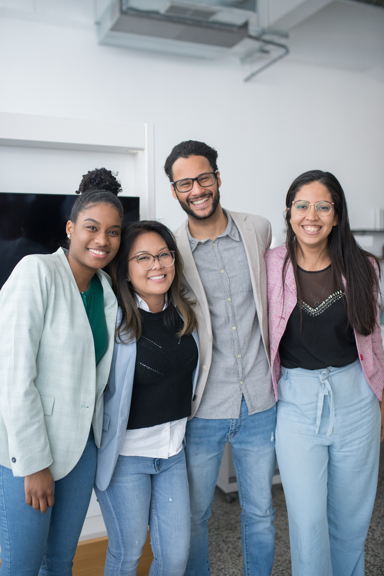 Office Team Smiling at the Camera
