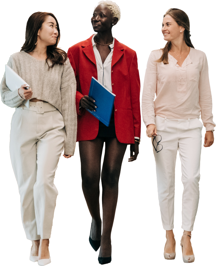Diverse Women with Laptops Walking Together