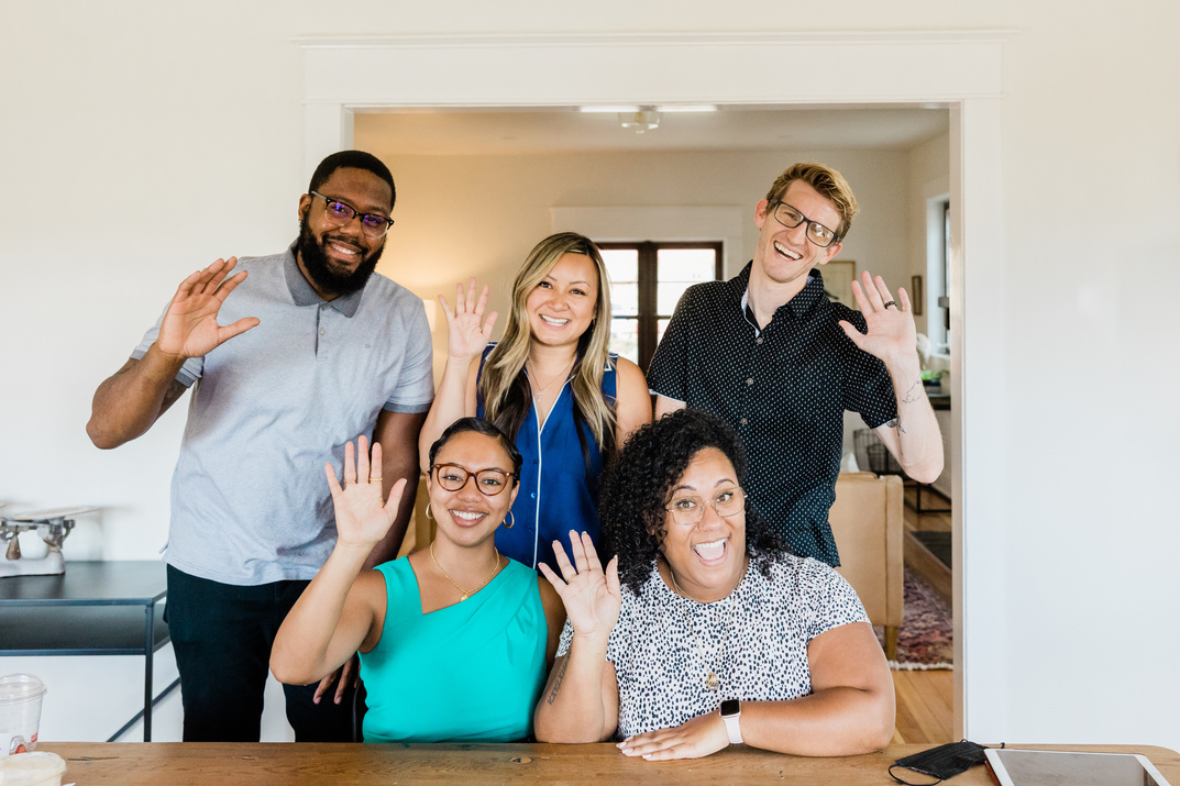 Colleagues Waving for a Group Photo