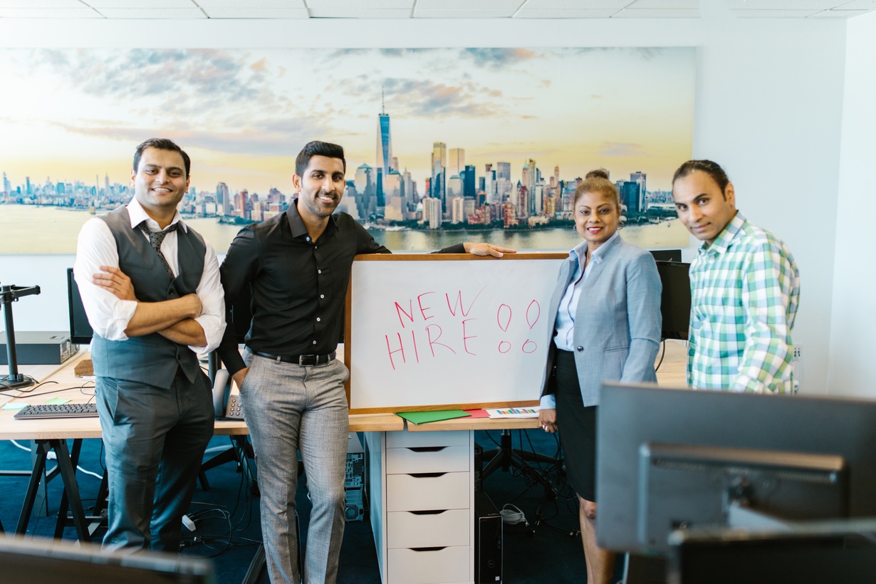 People Standing Beside a Whiteboard