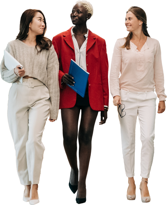 Diverse Women with Laptops Walking Together